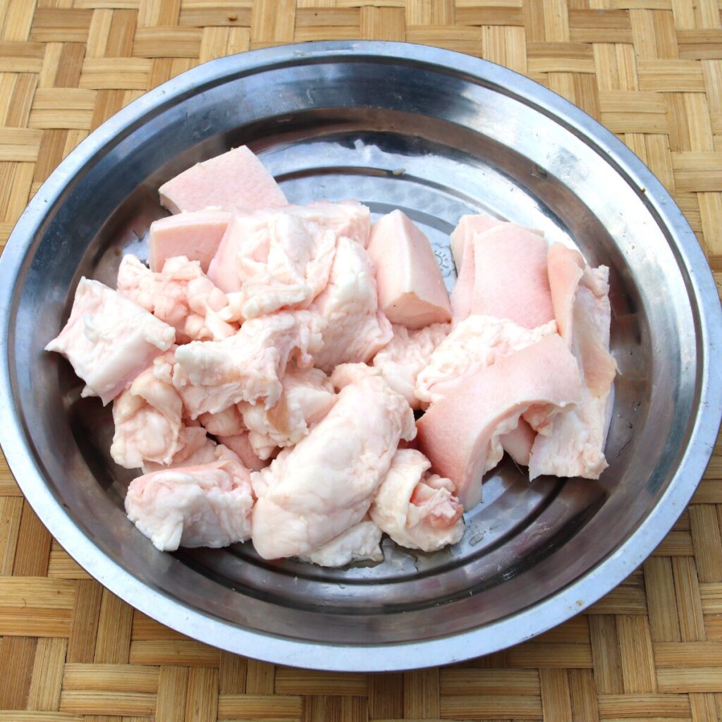 Beef tallow on a stainless bowl.
